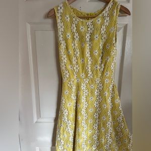 I am selling a yellow and white lace size 6 dress for $20.